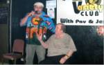 Bernard Manning seated with Pav compere at the Variety club Notts standing along side
